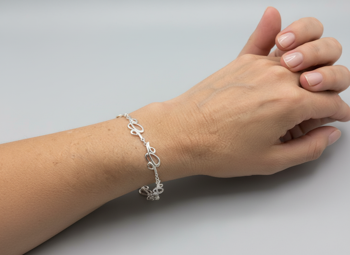 Silver Intricate Design Bracelet Tokash. free Delivery Uk.