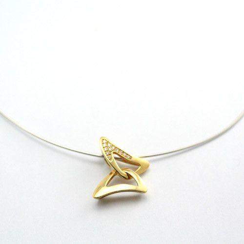 Thin silver necklace with interlocking gold triangles one set with diamonds