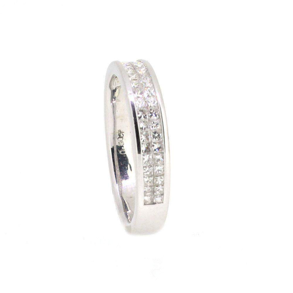 Silver ring with two rows of squarecut clear gemstones on sleek band