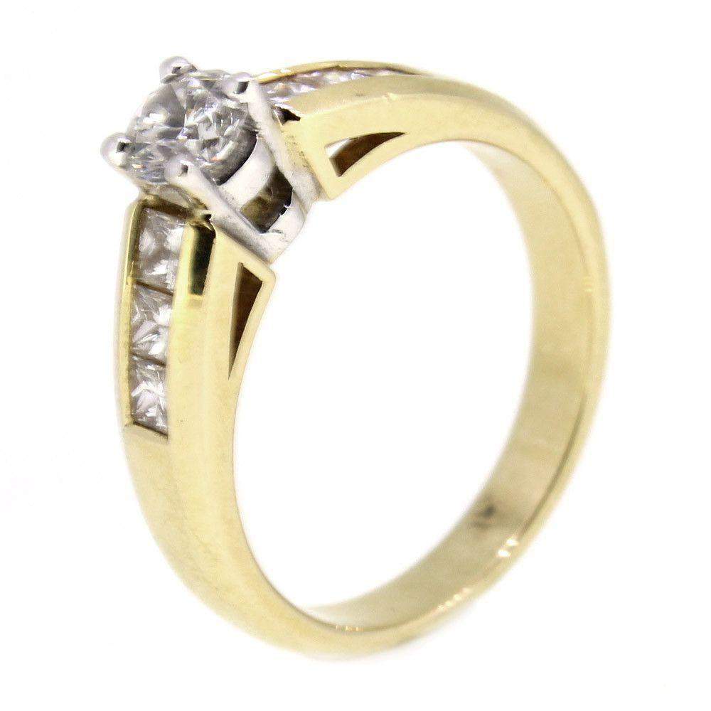 Gold ring with round diamond and four square diamonds