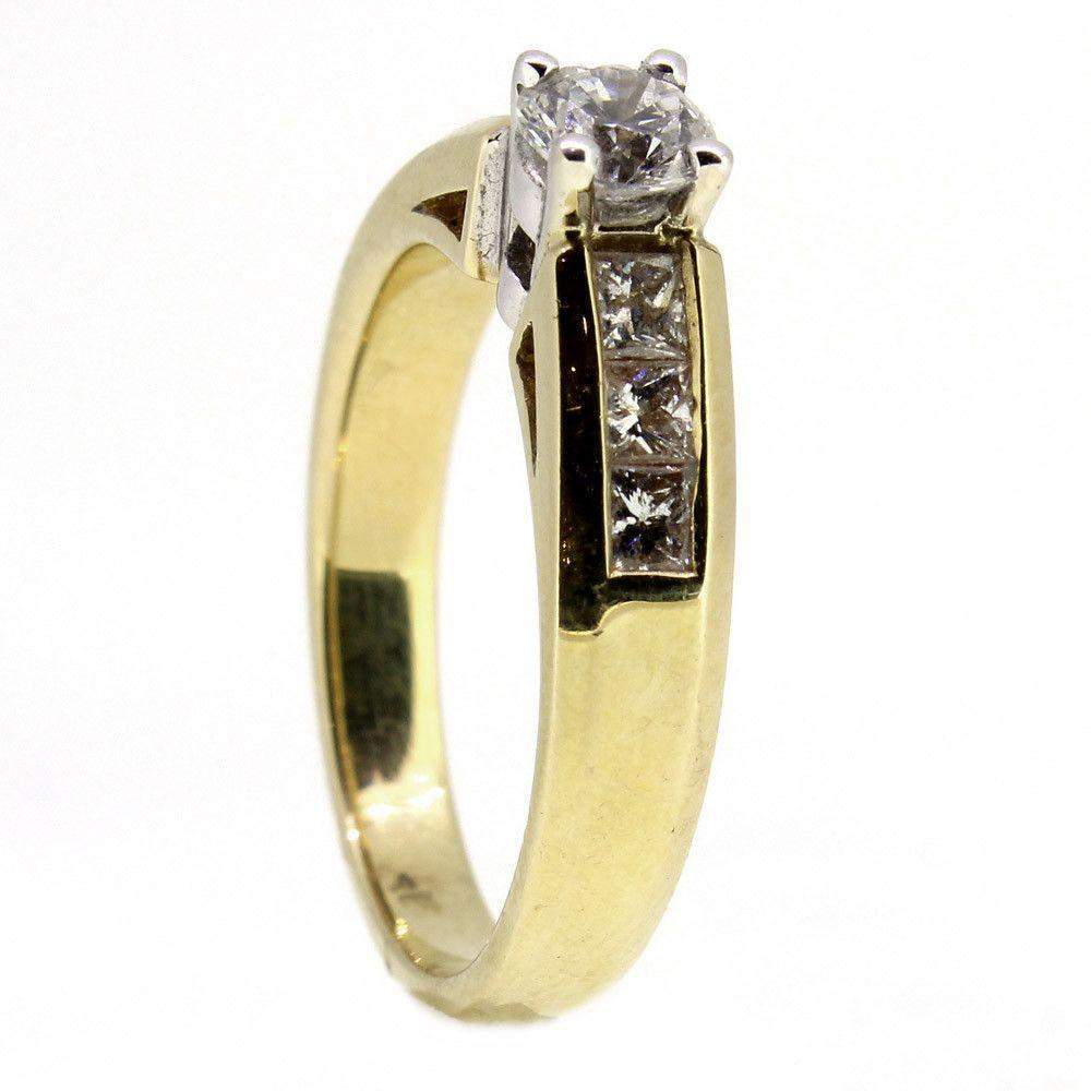 Gold ring with round diamond and four square diamonds