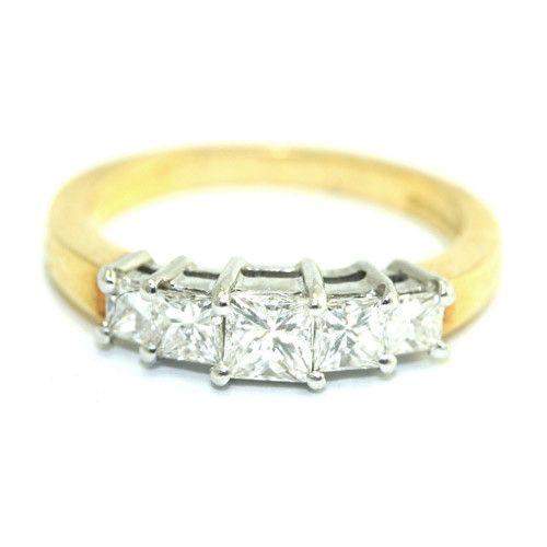 Gold ring with five squarecut diamonds set in a row