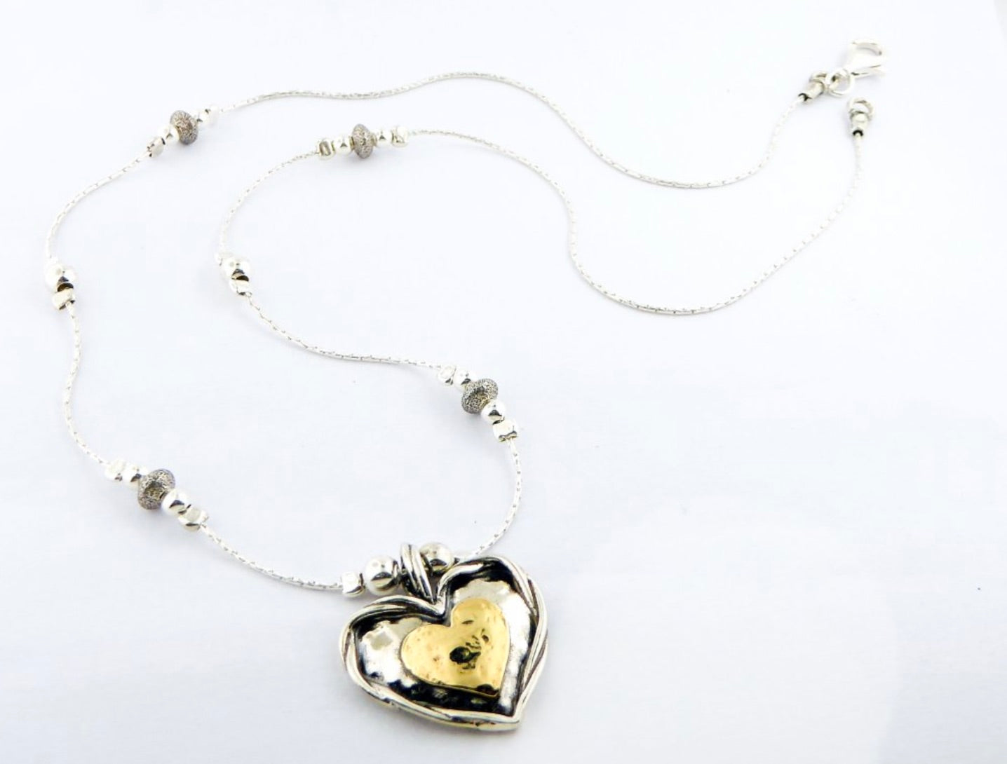 Shablool Designer Silver  Heart Necklace. with 9 carat gold heart. - N04436