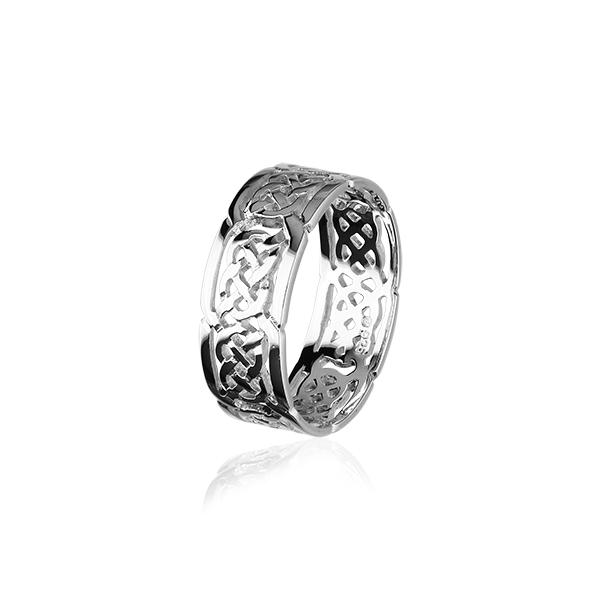 Silver ring with intricate Celtic knot pattern reflecting light on a white background