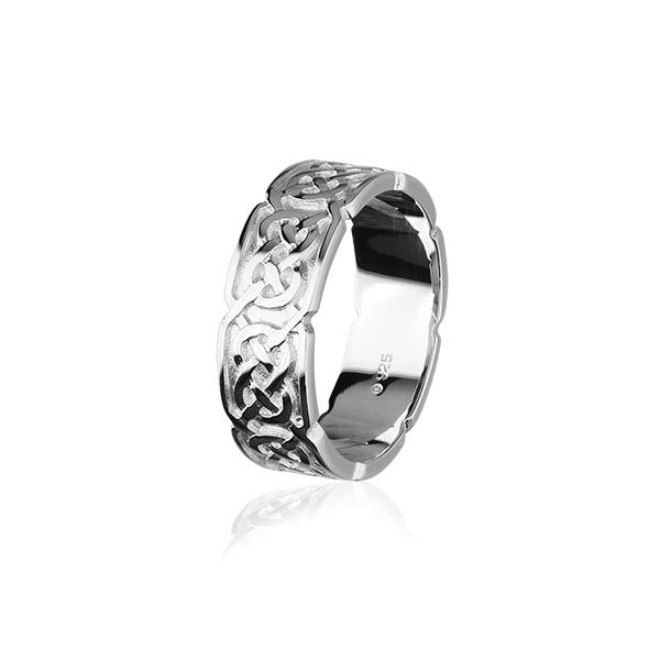 Silver ring with detailed Celtic knotwork, elegantly displayed on a shiny surface
