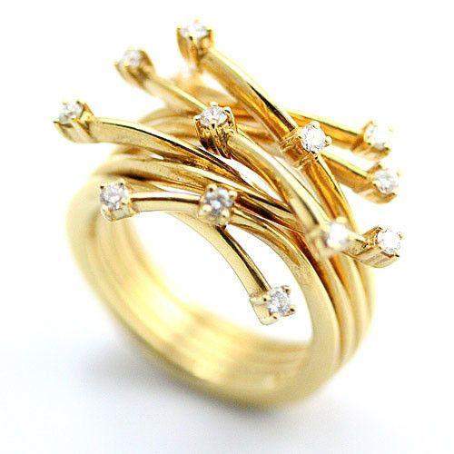 Gold ring with intertwined bands and diamond accents